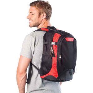 A black and red laptop backpack is worn by a smiling man, showcasing its design and functionality.