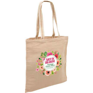 A beige eco jute tote bag with two handles and a floral design featuring various colours. It has a logo on one side.