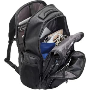 A black laptop backpack with multiple compartments, showcasing a laptop, cables, and other accessories inside.