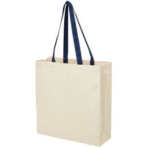 A heavy-duty canvas tote in natural colour with navy blue handles and a gusset for added capacity.