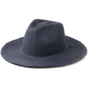 A navy blue straw hat with a wide brim and a slightly tapered crown, featuring a logo on the side.