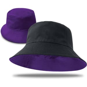 A reversible bucket hat featuring purple on one side and black on the other, with a logo present.