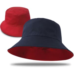 A reversible bucket hat featuring red on one side and navy blue on the other, with a branded logo.