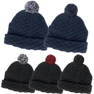 A collection of pom pom beanies in dark navy and dark green, featuring a textured pattern and contrasting pom poms.