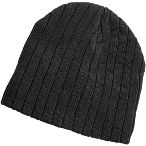A dark green cable knit beanie with a ribbed texture and a logo on the side.