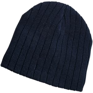 A navy blue cable knit beanie features a ribbed texture and has a logo on it.