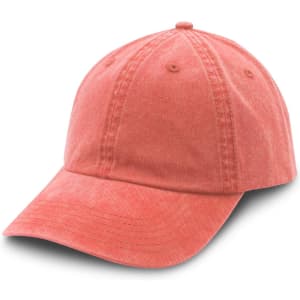 A washed chino cap in a soft coral colour with a curved brim and an adjustable back. It features a logo.
