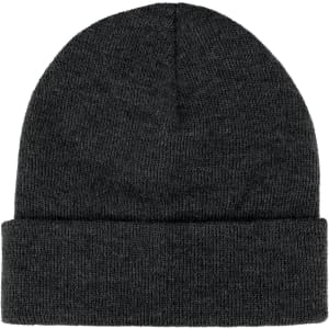 A dark grey knitted beanie featuring a rolled cuff and a small logo.