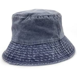 A washed chino bucket hat featuring a two-tone design in shades of blue. Includes a logo detail.