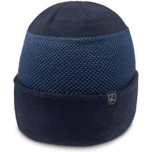 A navy beanie featuring a textured upper design and a smooth lower band with a logo.