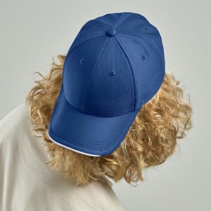 A navy cap with a structured design and a curved peak, featuring a logo on the front.