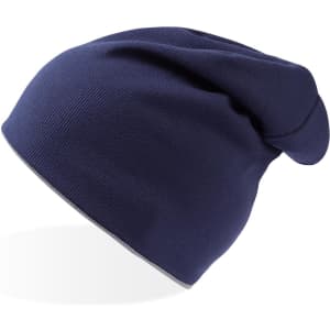 A navy blue beanie with a slouchy fit and a logo on the side.