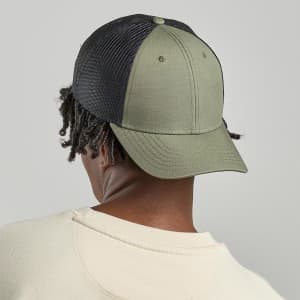 A green and black cap featuring a mesh back and a curved brim, designed for headwear. It has a logo on the front.