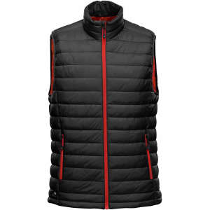A black thermal vest with red accents, featuring a high collar and zip closure, and a logo on the side.