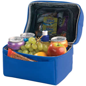 A blue lunch bag containing cans, grapes, an apple, an orange, and assorted snacks, with a zippered compartment.