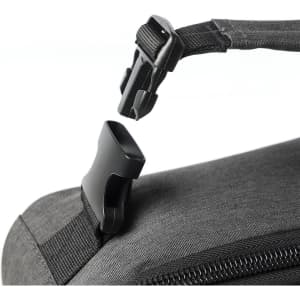 A close-up of a black cooler bag featuring a buckle strap and zipper. The bag has a sleek, modern design.