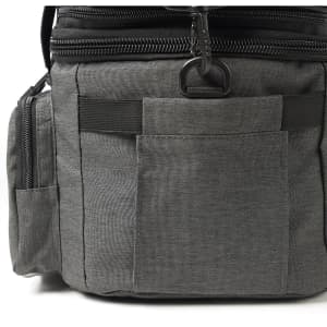 A grey expanding cooler with multiple pockets and zippers, featuring a sleek design and a black trim.