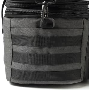 A grey expanding cooler with black webbing and a zipper closure. Features a durable fabric and sturdy construction.