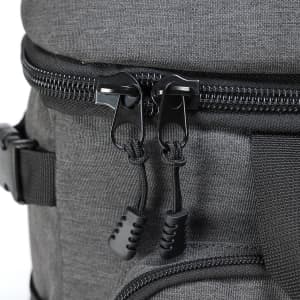 A grey backpack cooler featuring dual black zippers with textured pull tabs for easy access.
