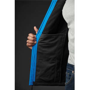 A close-up of a men's softshell jacket featuring blue exterior and a black lining, with a hand holding the open zipper.