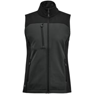 A women's softshell vest in dark green and black, featuring a high collar and multiple zippered pockets.
