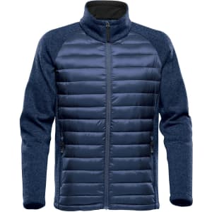 A navy blue hybrid jacket featuring a quilted front and fleece-like sleeves, with a zip and two side pockets.