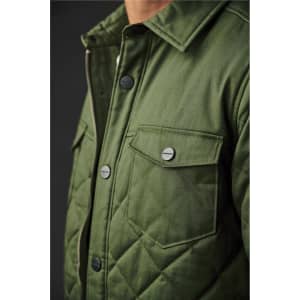 A green quilted jacket featuring chest pockets and snap buttons, presented on a dark background.