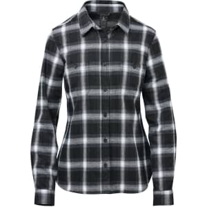 A long-sleeve button-up shirt in black and white plaid, featuring two chest pockets and a logo.