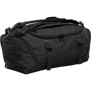 A duffel bag in dark grey with black accents, featuring multiple compartments and carrying handles, and a logo.