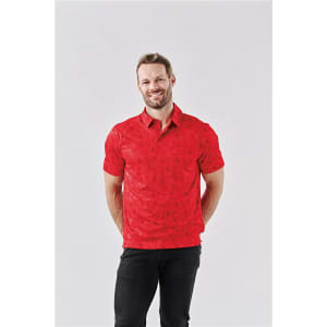 A man wearing a red polo shirt with a subtle pattern, featuring a logo on the chest and a classic collar.