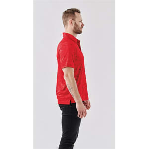 A red polo shirt featuring a subtle pattern, displayed on a model from the side. It has a logo on the chest.