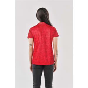 A red women's polo shirt with a subtle pattern, featuring a collar and short sleeves. It has a logo on the front.
