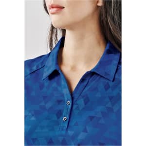 A close-up of a blue women's polo shirt featuring a geometric pattern and a classic collar with buttons.