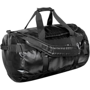 A large black duffle bag with sturdy handles and adjustable straps, featuring a logo.
