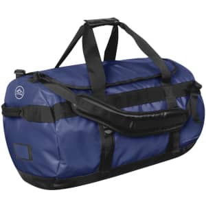 A medium duffle bag in navy blue with black accents and a sturdy handle. It features a logo on one side.