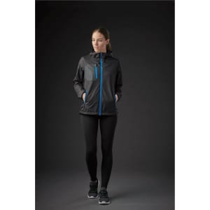 A woman wearing a black rain jacket with blue accents, featuring a zip front and a pocket.