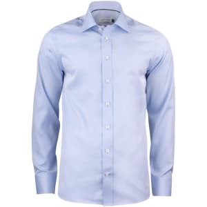 A button-up shirt in light blue with long sleeves and a collar, featuring a logo.