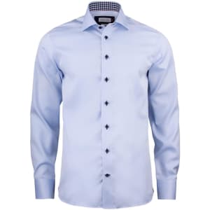 A light blue button-up shirt with long sleeves, featuring a checkered collar and black buttons. It has a logo.