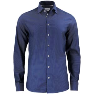 A navy button-up shirt featuring a subtle pattern, with a collar and long sleeves. It includes a logo on the fabric.