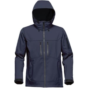 A navy blue softshell jacket with a hood and multiple zippered pockets. It features a branding logo on the side.