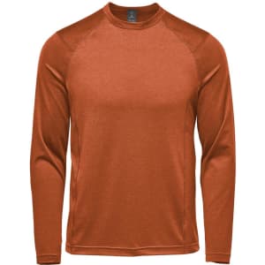 A long sleeve crew neck shirt in a rich rust colour, featuring raglan sleeves and a logo.