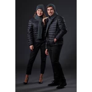 A black puffer jacket worn by two models, paired with grey beanies and scarves, against a dark background.