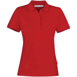 A red women's polo shirt featuring a collar and a branding logo. The shirt is made of cotton.