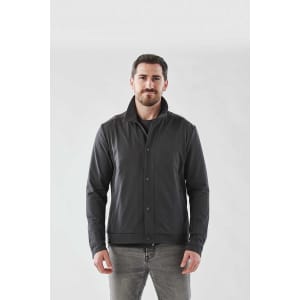 A man wearing a black Men's Soho Jacket, front view, against a plain background. The jacket has a logo on it.