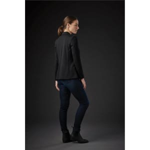 A black women's knit blazer, styled with dark jeans, displayed from the side against a dark background.
