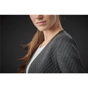 A close-up of a woman wearing a dark grey, quilted women's Chelsea open cardigan, featuring a casual style.