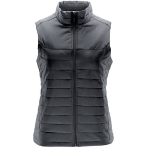A women's quilted vest in a dark grey colour, featuring a high collar and a zippered front. Includes a logo.