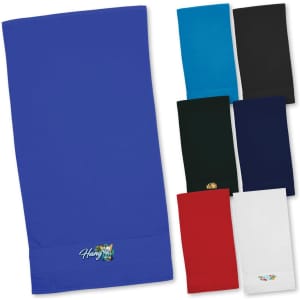 A selection of Terry Velour Towels in various colours including blue, black, green, red, and white, with a logo on one.