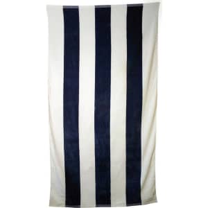 A striped towel featuring navy blue and cream stripes, prominently displayed against a white background. It has a logo.