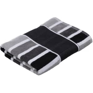 A folded black and grey striped towel featuring a branding logo.